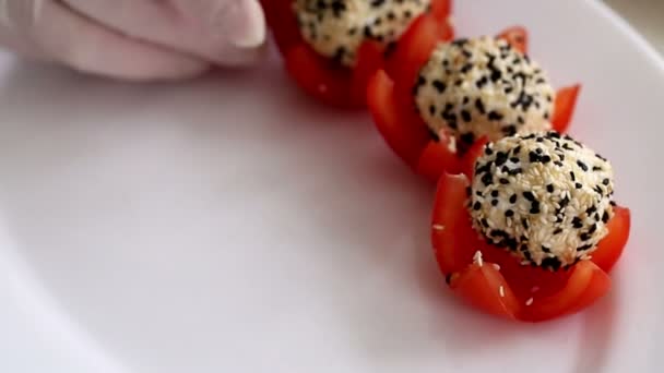 Cook Arranges Cheese Balls Sesame Seeds Tomatoes White Plate — Stock Video