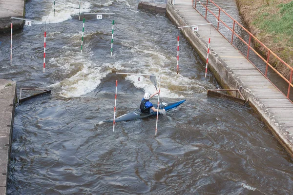 Kayak training, Kayak Race near the bridge where water strong whirlpools arise near the piles