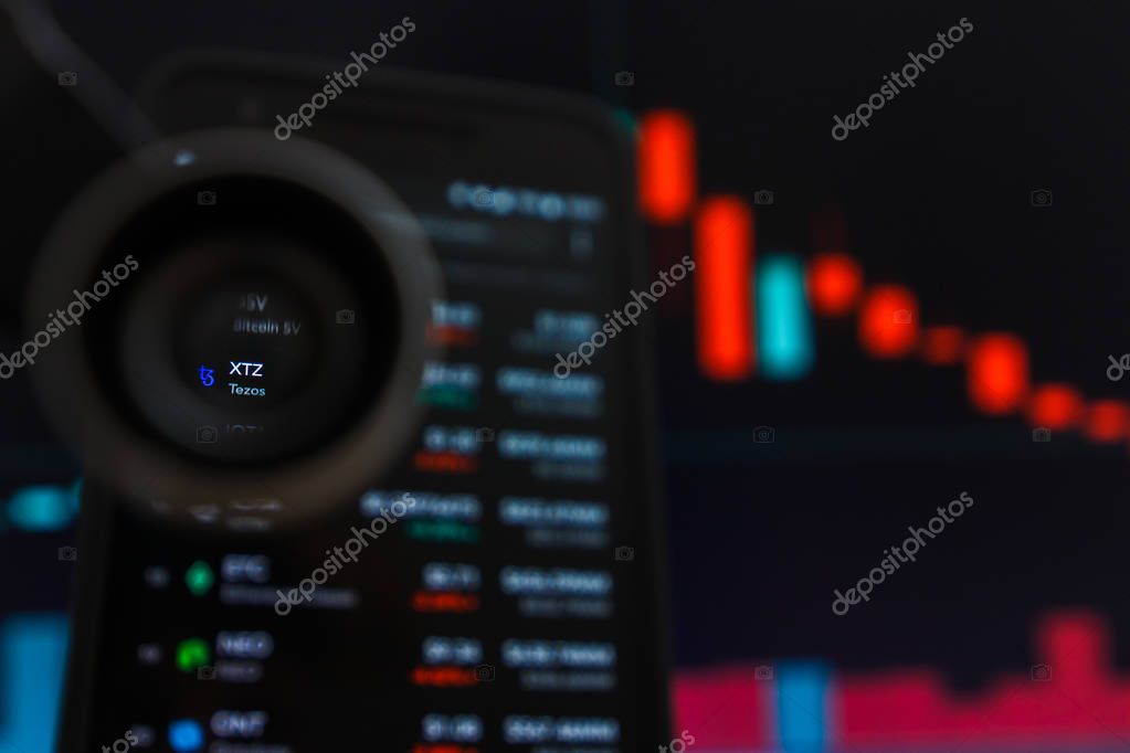 SAN FRANCISCO, US - 9 May 2019: A Graph of Decreasing Trend of XTZ Tezos Cryptocurrency. The Illustration of Red Candles Bar Falling Down Trend, San Francisco, California, USA. An Illustrative Editorial Image