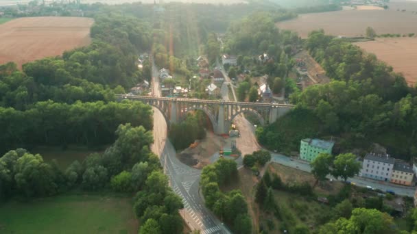 Aerial View of Old Bridge Viaduct in Green Wood Near The Village. Railroad Over Valley. — Stock Video