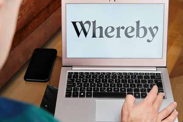 Whereby is used for business meeting on laptop by man. An illustrative editorial image. San Francisco, US, June 2020 — Stock Photo, Image