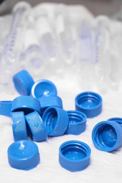 Used centrifuge tubes with blue caps for sample collection and preparation. Biochemical or analytical analysis. Plastic waste at the laboratory