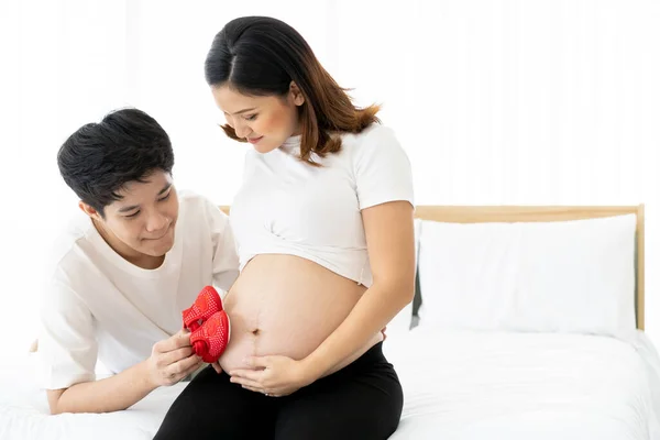 Asian Ethnicity Happy Pregnant Woman Showing Baby Red Shoes Her — Stock Photo, Image