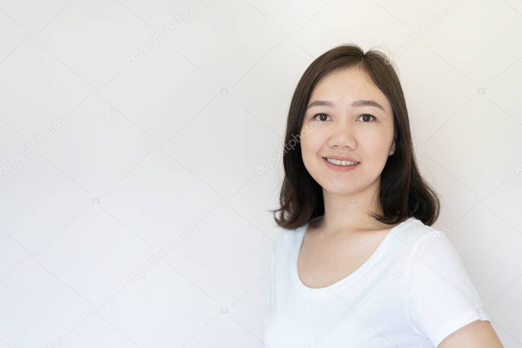 Portrait of Asian beautiful woman age around 25 - 30 years old on white background with copy space. Confident Asian young adult portrait in thoughtful emotion.