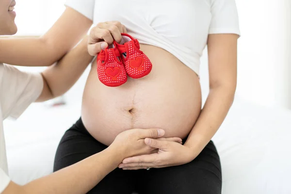 Asian Ethnicity Happy Pregnant Woman Showing Baby Red Shoes Her — Stock Photo, Image