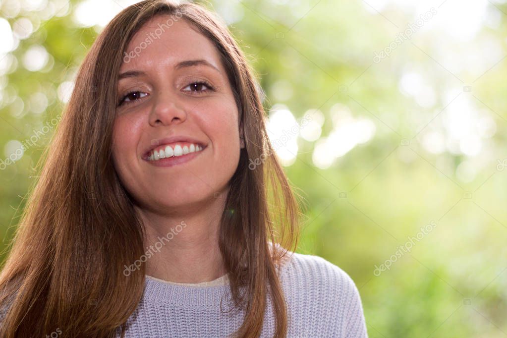 Woman or young european caucasian university girl or student happy and self-confident smiling at camera