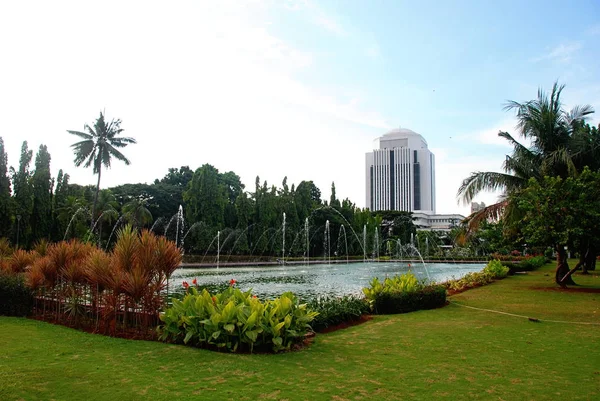 Park and gardens with lake of Merdeka Square in Central Jakarta, Indonesia