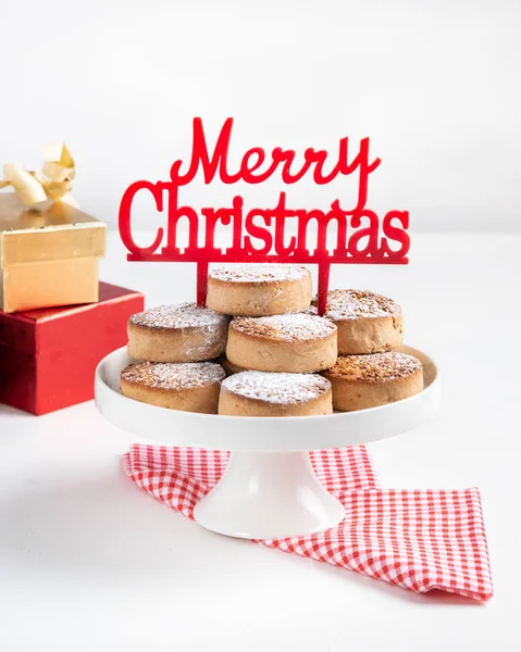 Traditional Christmas cookies, nevaditos, with almonds and sesame on white wooden background with copy space. Close up. Christmas and New Year celebration concept. Holiday decoration. — Stock Photo, Image