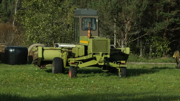 Farm machine on the edge of a farm field