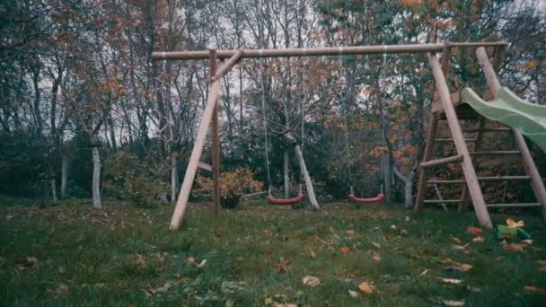 Children Red Swings Lonely Swinging Wind Autumn Cloudy Day Old — Stock Video