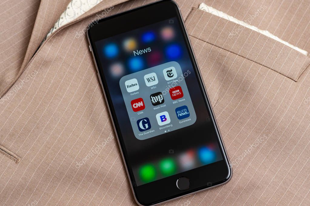 New York / USA - 02/23/2019: Black Apple iPhone with icons of News media: Forbes, WSJ, NY Times, CNN, WP, BBC News, Guardian, Bloomberg and Euronews applications on screen. News media icons.