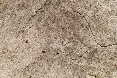 Çok eski bir beton duvar dekoratif veya desenli bir yüzeydir. Arkaplan olarak ya da tasarım amaçlı kullanılabilir