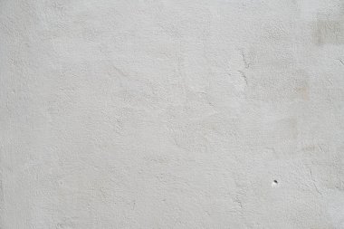 Beyaz ya da gri beton duvar dekoratif ya da desenli bir yüzey. Arkaplan olarak ya da tasarım amaçlı kullanılabilir
