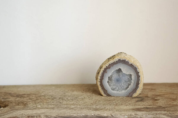 Geode on Wood Surface with White Background
