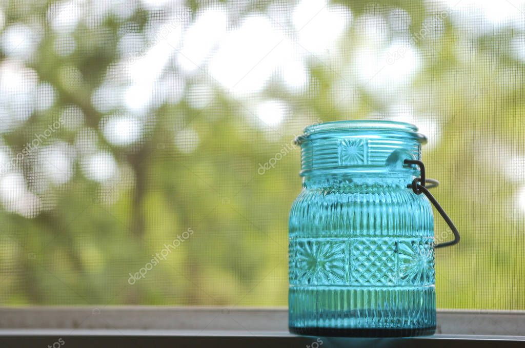 Blue Glass Jar in Open Window