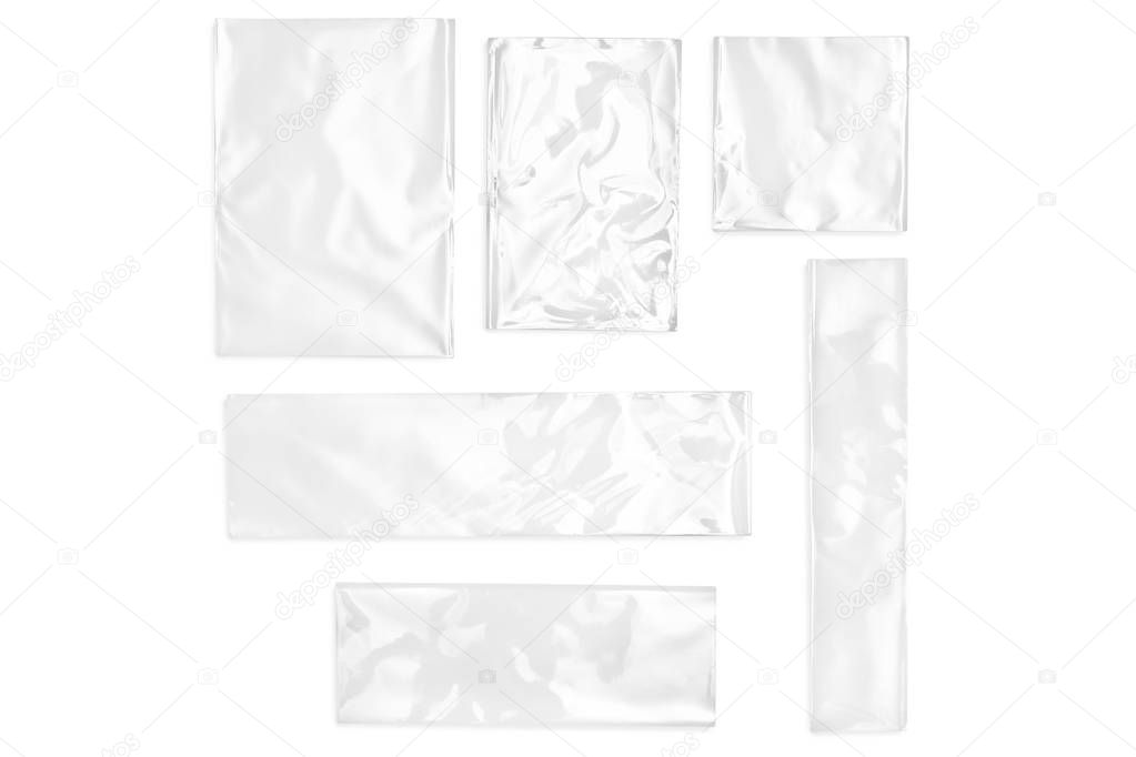 Few cellophane bags for candy. White bags package template in different size  on isolated background.