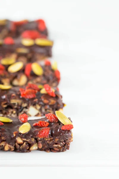 Vegan Chocolate Bars Granola Nuts Pumpkin Goji Berries Chia Seeds — Stockfoto