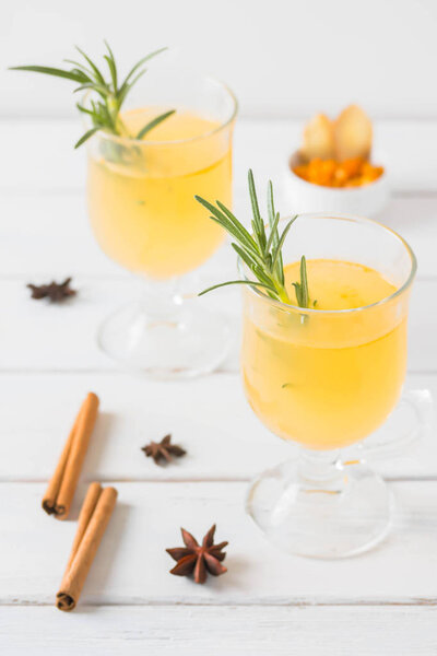 Sea buckthorn spicy drink with honey, ginger, cinnamon and star anise.