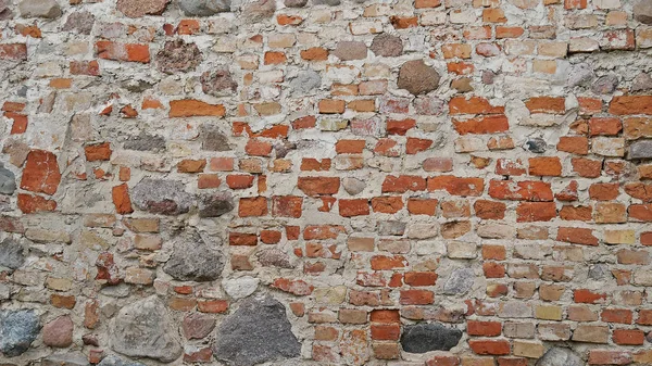 Yıpranmış grunge arka plan eski tuğla duvar ve dökülüyor. Çimento