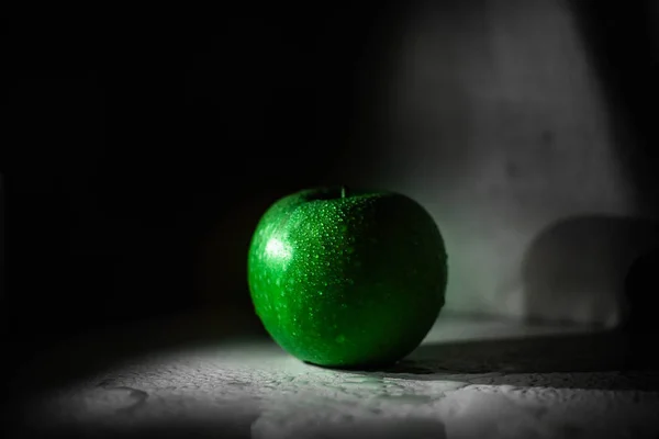 Green tasty granny smith apple on the table