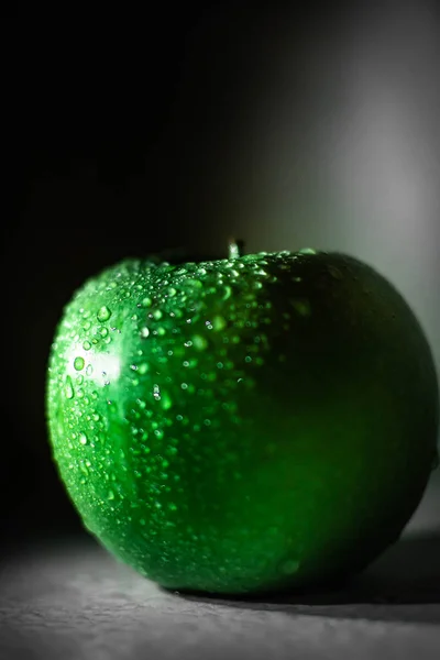 Green tasty granny smith apple on the table