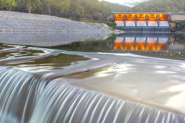 Scenic view of river dam in sunset light