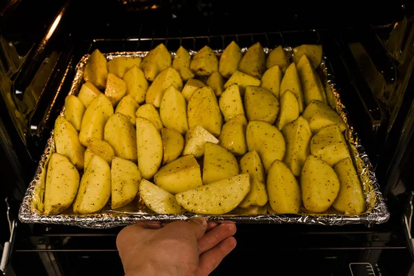 Raw cut potatoes before cooking, home made country french fries already to cook. Selective focus