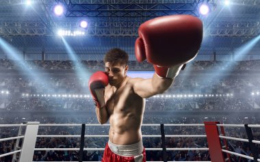 İki boksör profesyonel boks ringinde dövüşüyor..