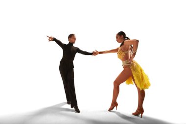 Couple dancers  perform latin dance on white background. clipart