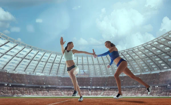 Female athlete on professional athletics stadium.