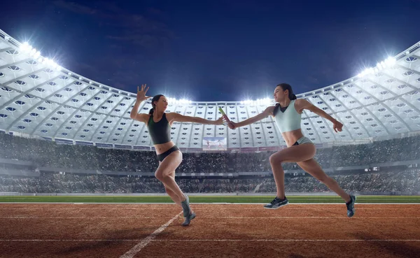 Female athlete on professional athletics stadium.