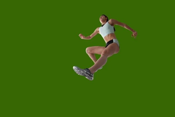 Sportlerin Sportkleidung Auf Grünem Hintergrund — Stockfoto