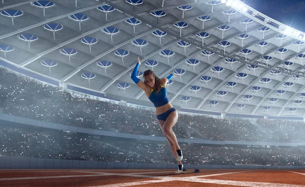 Female athlete on professional athletics stadium.