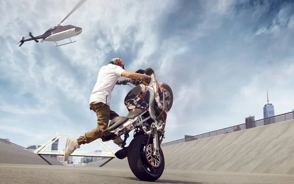 Moto freestyle. Motorcycle stunt rider