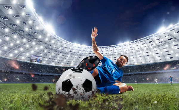 Soccer players in action on professional stadium.
