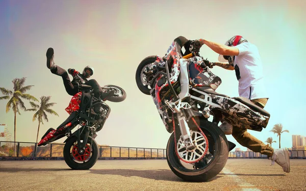 Moto rider making a stunt on his motorbike. Biker doing a difficult stunt. Composite image