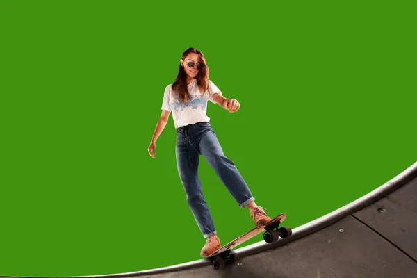 Skateboarder isolated on green screen.