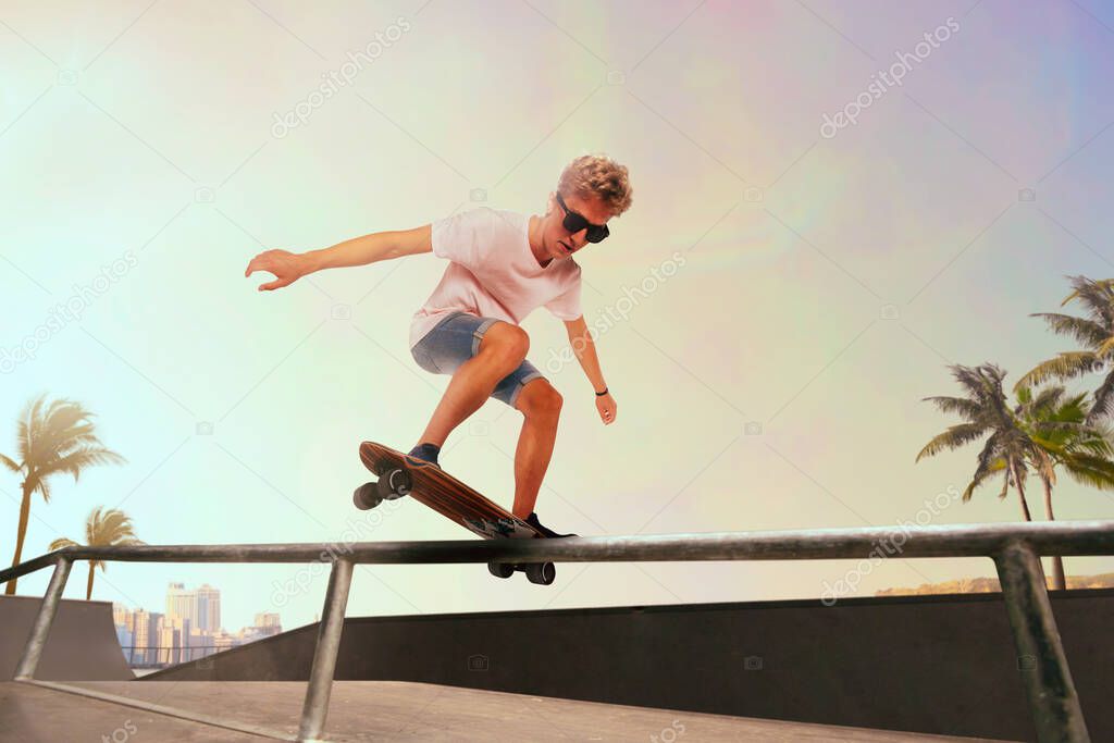 Skateboarder is performing tricks in skatepark on sunset.