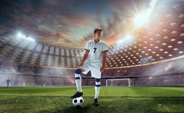 Soccer players in action on professional stadium.