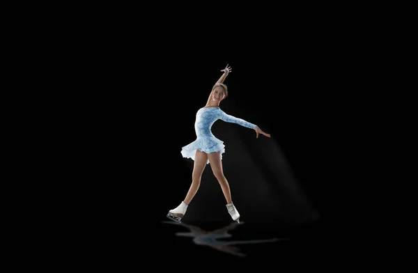 Young woman figure skating.