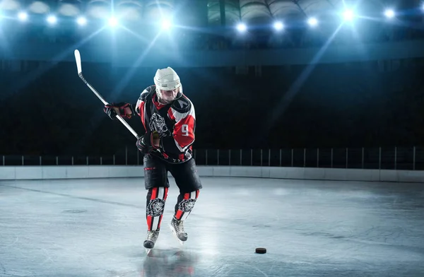 Ice hockey player at arena.