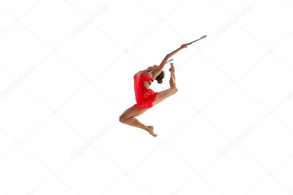 Rhythmic gymnast isolated on white.