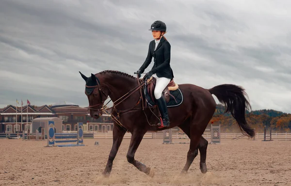 Equestrian sport. Woman riding horse.
