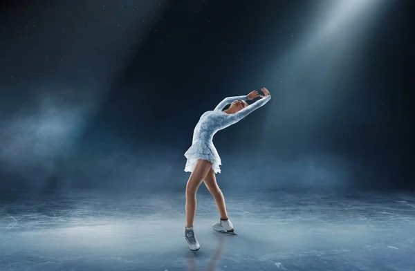 Young woman figure skating.