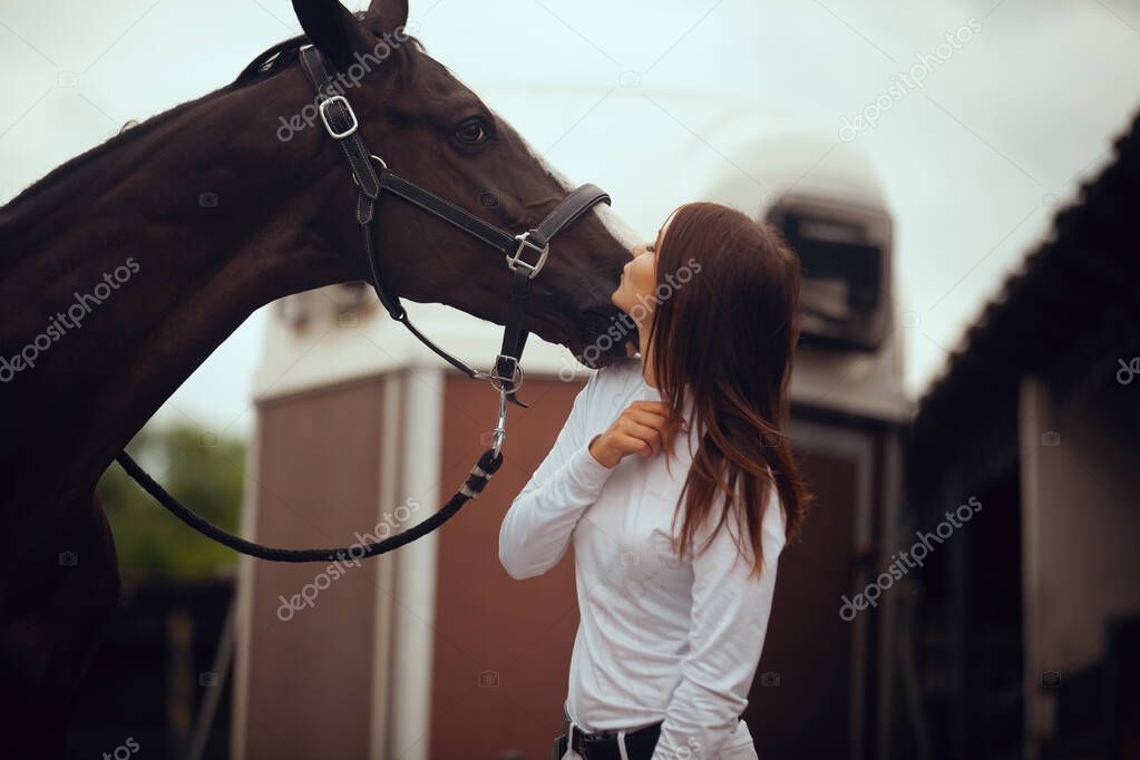 Equestrian sport - young girl rides on horse.