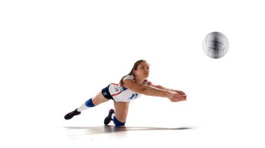 Female professional volleyball players in action on white backgr clipart