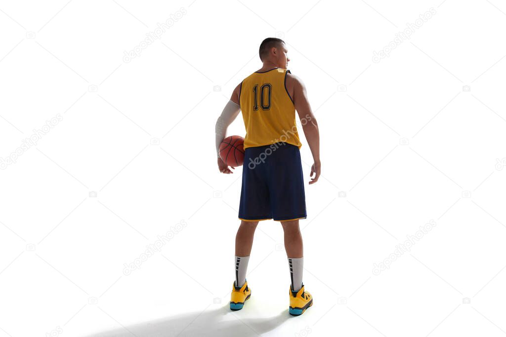 Basketball player isolated on white.