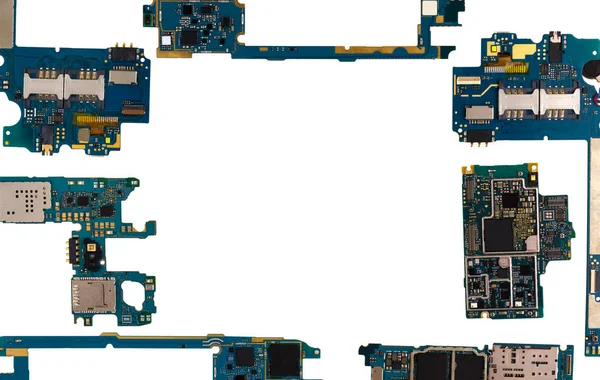 Motherboard for smartphone. Spare parts with microcircuits for the phone are located at the edges of the frame.