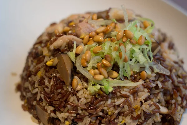 Fried Organic Red Rice with Pine Nuts, Chicken and Mixed Vegetables