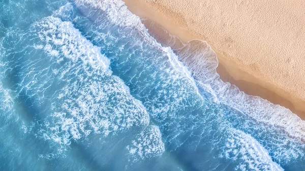 Beach and waves from top view. Aerial view of luxury resting at sunny day. Summer seascape from air. Top view from drone. Travel concept and idea